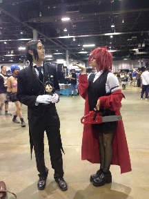 Mya at Anime West 2015, cosplaying as Grell Sutcliff from Black Butler, with Sebastion Michaels from Black Butler